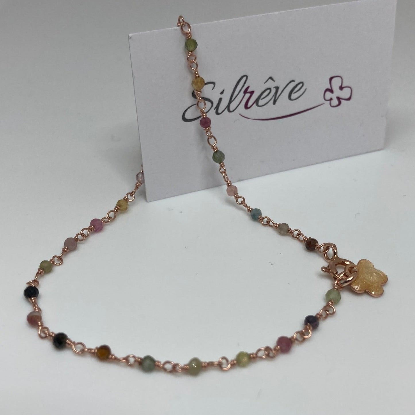 Braccialetto 'nodo orefice' in Ag. 925 rosato, con pietre preziose
