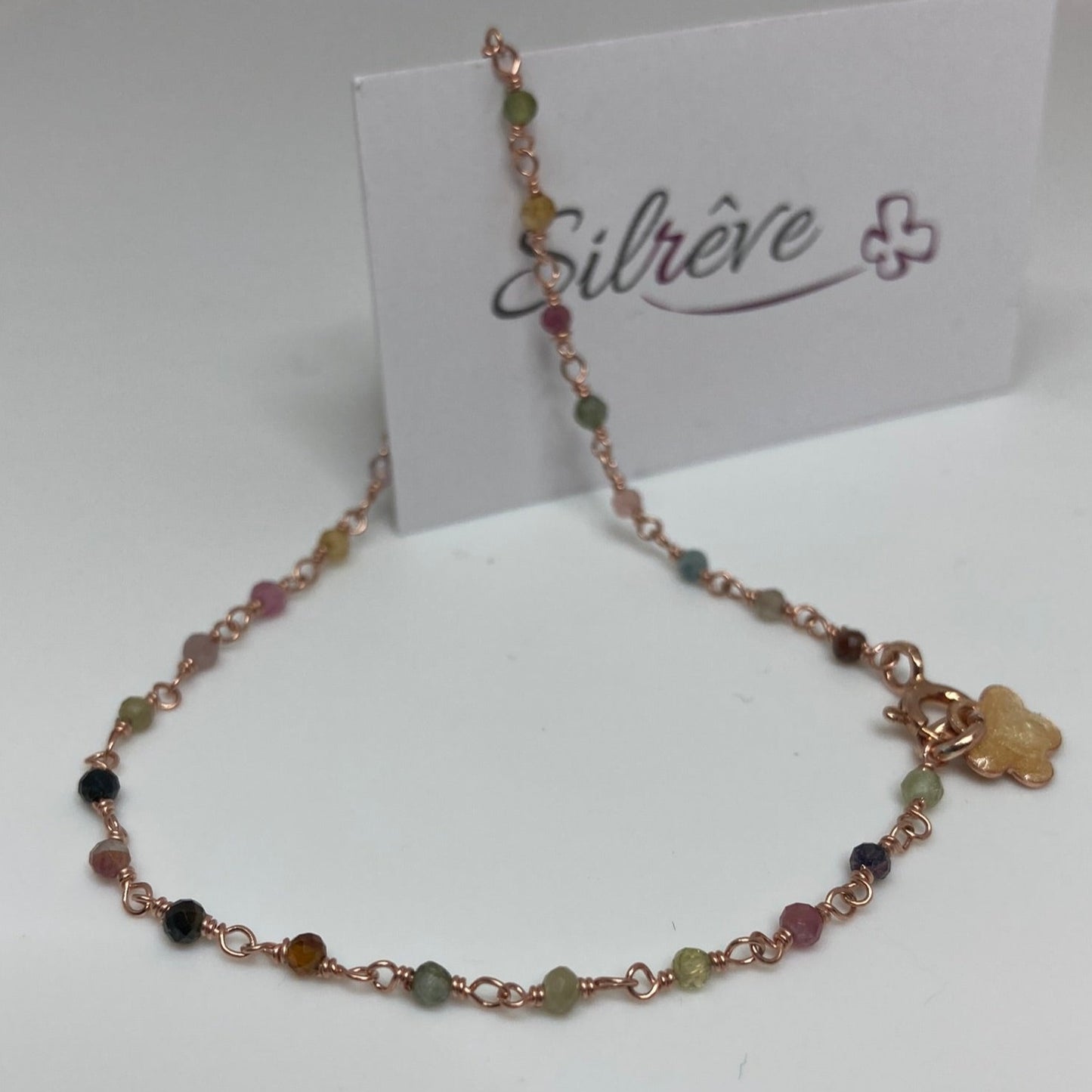 Braccialetto 'nodo orefice' in Ag. 925 rosato, con pietre preziose