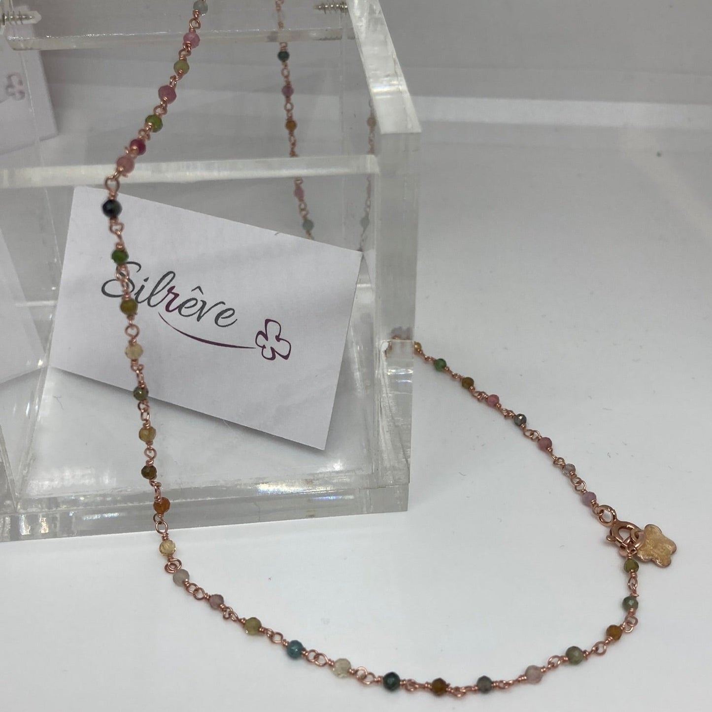 Girocollo 'nodo orefice' in Ag. 925 rosato, con pietre preziose